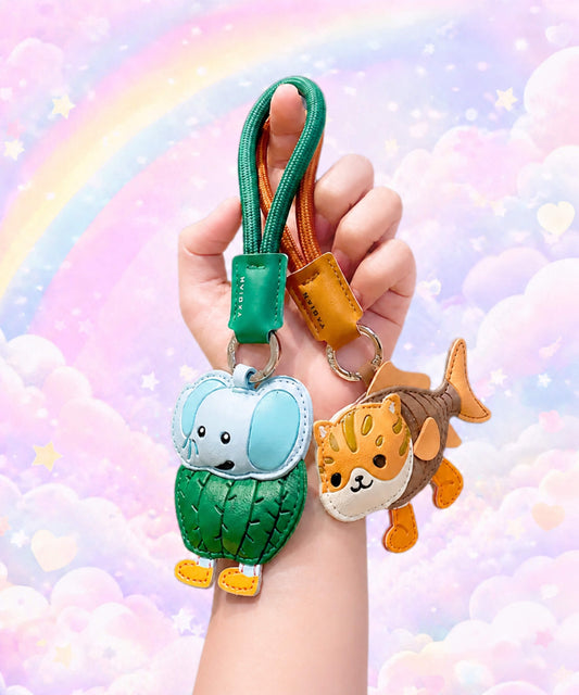 Lirily Larila and Trulimero Trulicina Italian Brainrot style PU leather keychains held against a pastel rainbow background.