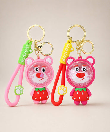 Strawberry Bear bead shaker keychains in red and pink colour options on a neutral background