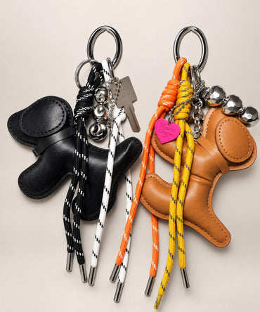 Dog PU leather bag charm keychains in Black and Brown with rope details