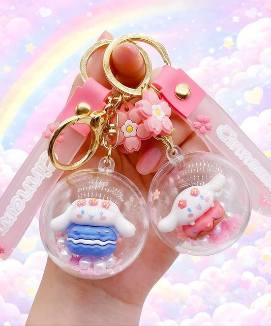 Sanrio Cinnamoroll shaker keychain with floating beads held in hand, cute pastel rainbow cloud background, bubble charm design