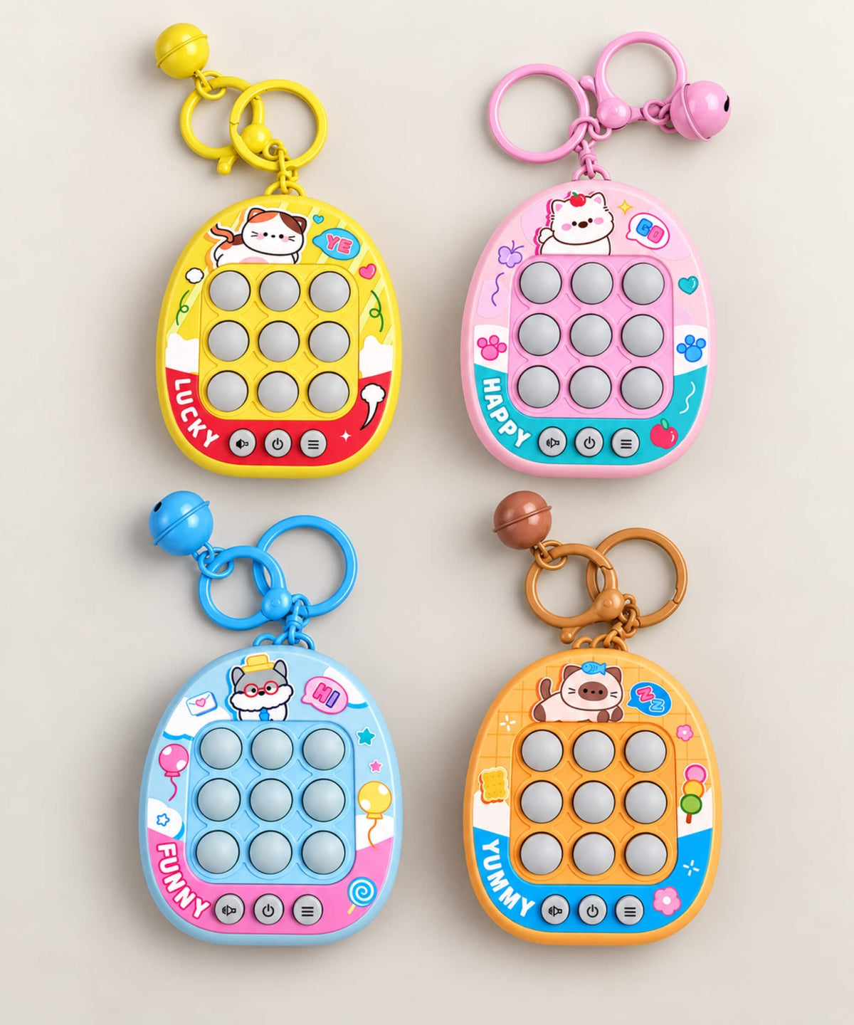 Four colourful 3-in-1 Tic Tac Toe game keychains with light-up buttons