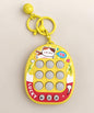 Yellow 3-in-1 Tic Tac Toe game keychain with nine game buttons