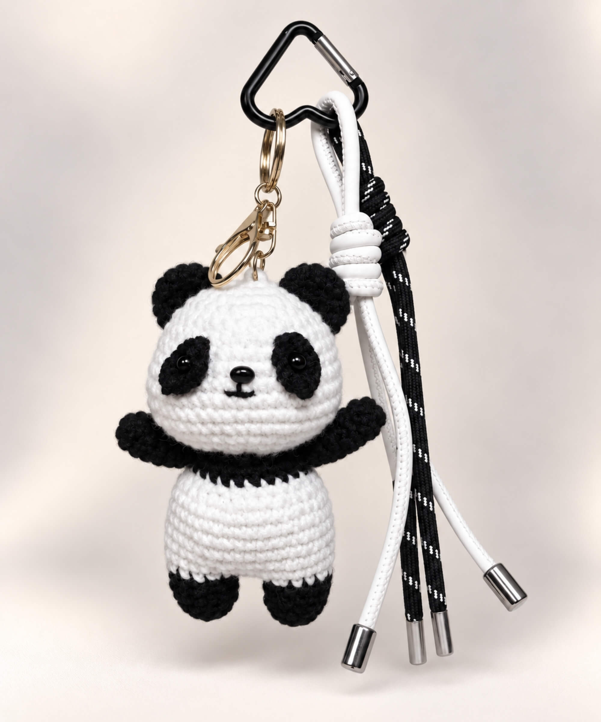 Black and white panda crochet keychain with matching hanging cords