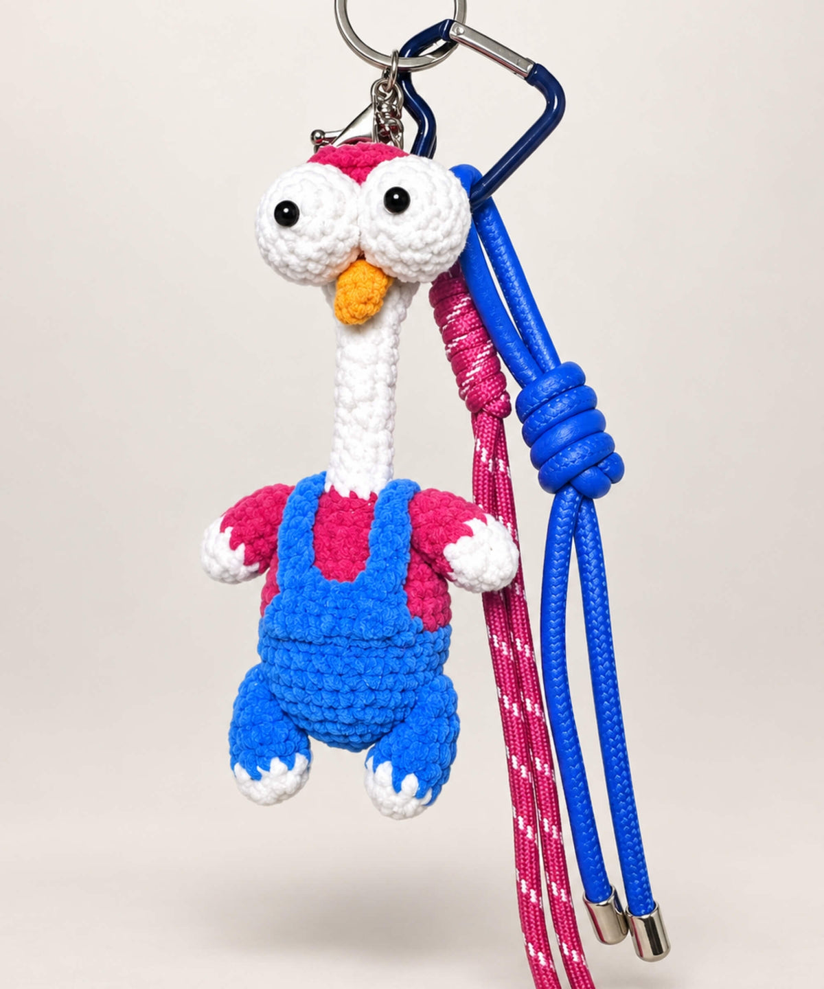 Long-neck chicken crochet keychain with colourful outfit and hanging cords