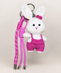 White bunny crochet keychain wearing pink overalls with pink hanging cords