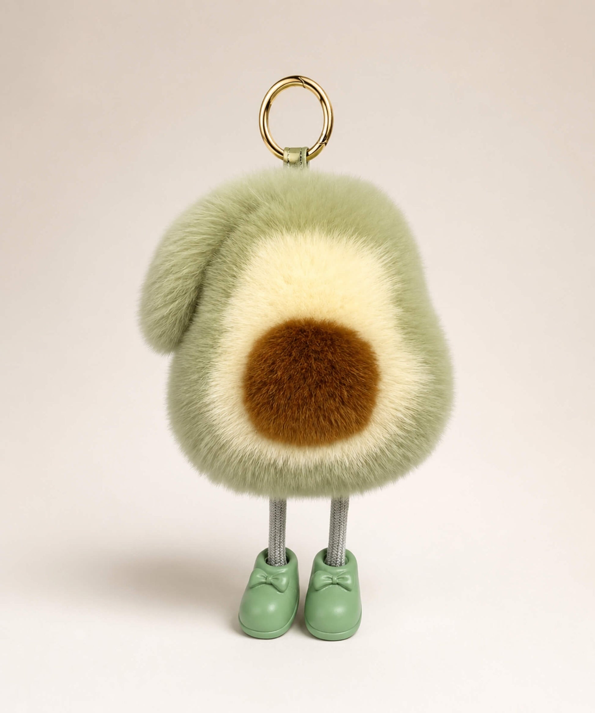 Avocado plush keychain with soft fluffy texture, green shoes and gold hardware