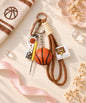 Basketball rope keychain with mini basketball charm, accessory charm and brown rope strap