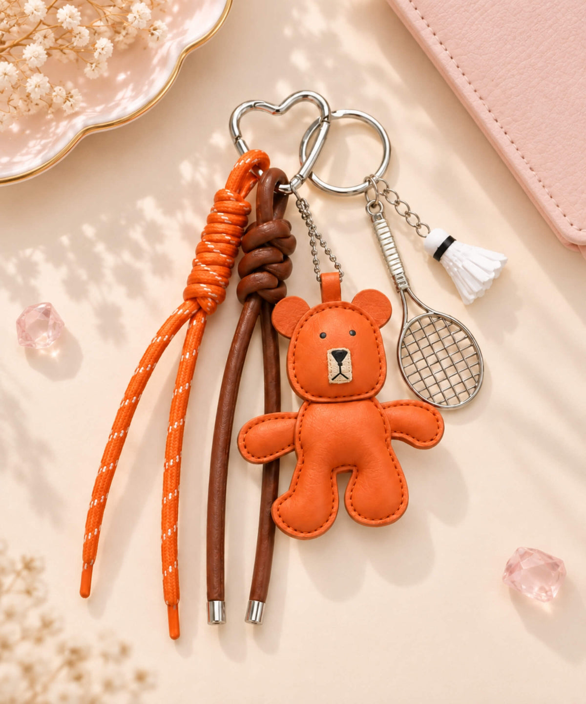 Orange bear PU leather bag charm keychain with badminton racket, shuttlecock and rope straps