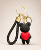 Black knitted-look heart bear resin keychain with red heart detail and black braided wrist strap