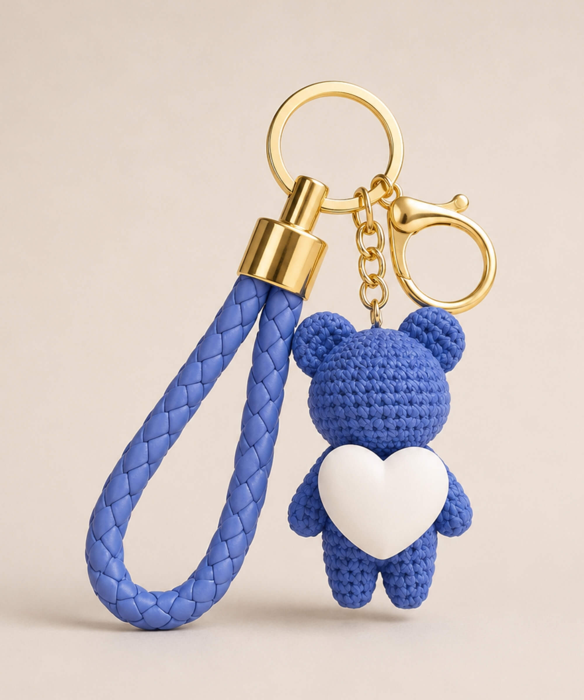 Blue knitted-look heart bear resin keychain with white heart detail and braided wrist strap