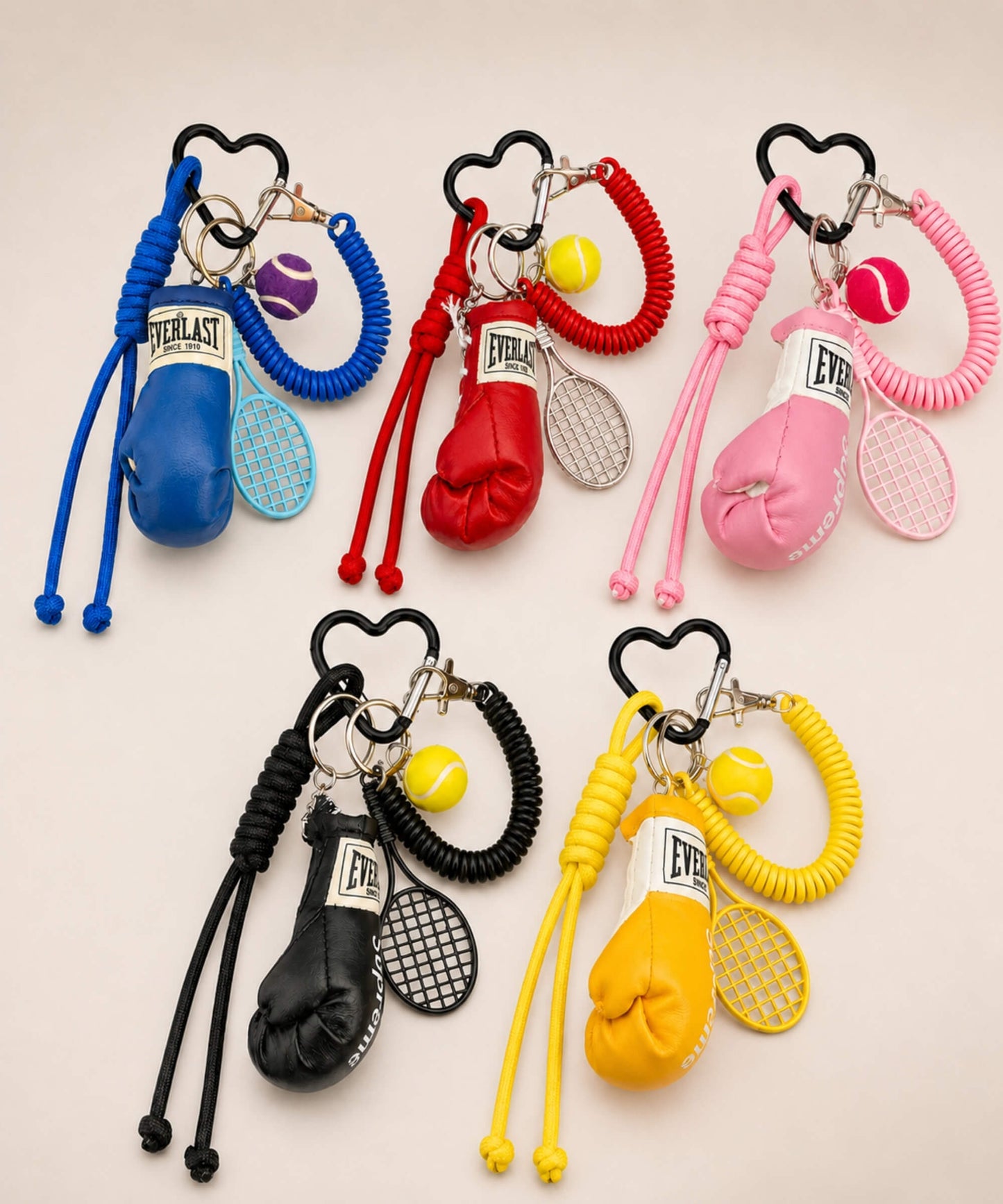 Boxing glove and tennis rope keychains in blue, red, pink, black and yellow colour options