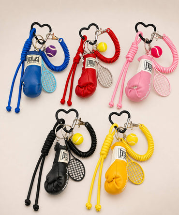 Boxing glove and tennis rope keychains in blue, red, pink, black and yellow colour options