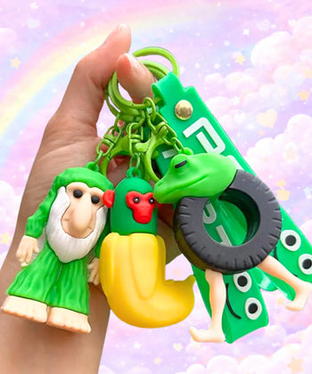 Funny brainrot style character keychains held in hand, weird meme bag charms with random quirky designs and pastel background