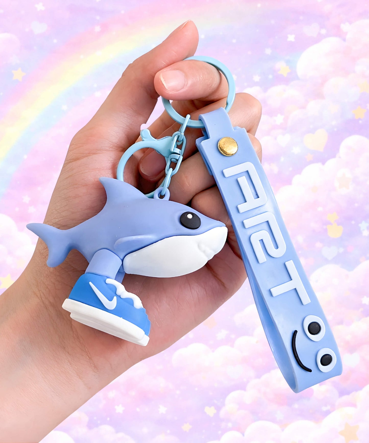 Funny brainrot style shark keychain with sneaker design held in hand, cute weird meme animal bag charm with pastel rainbow background