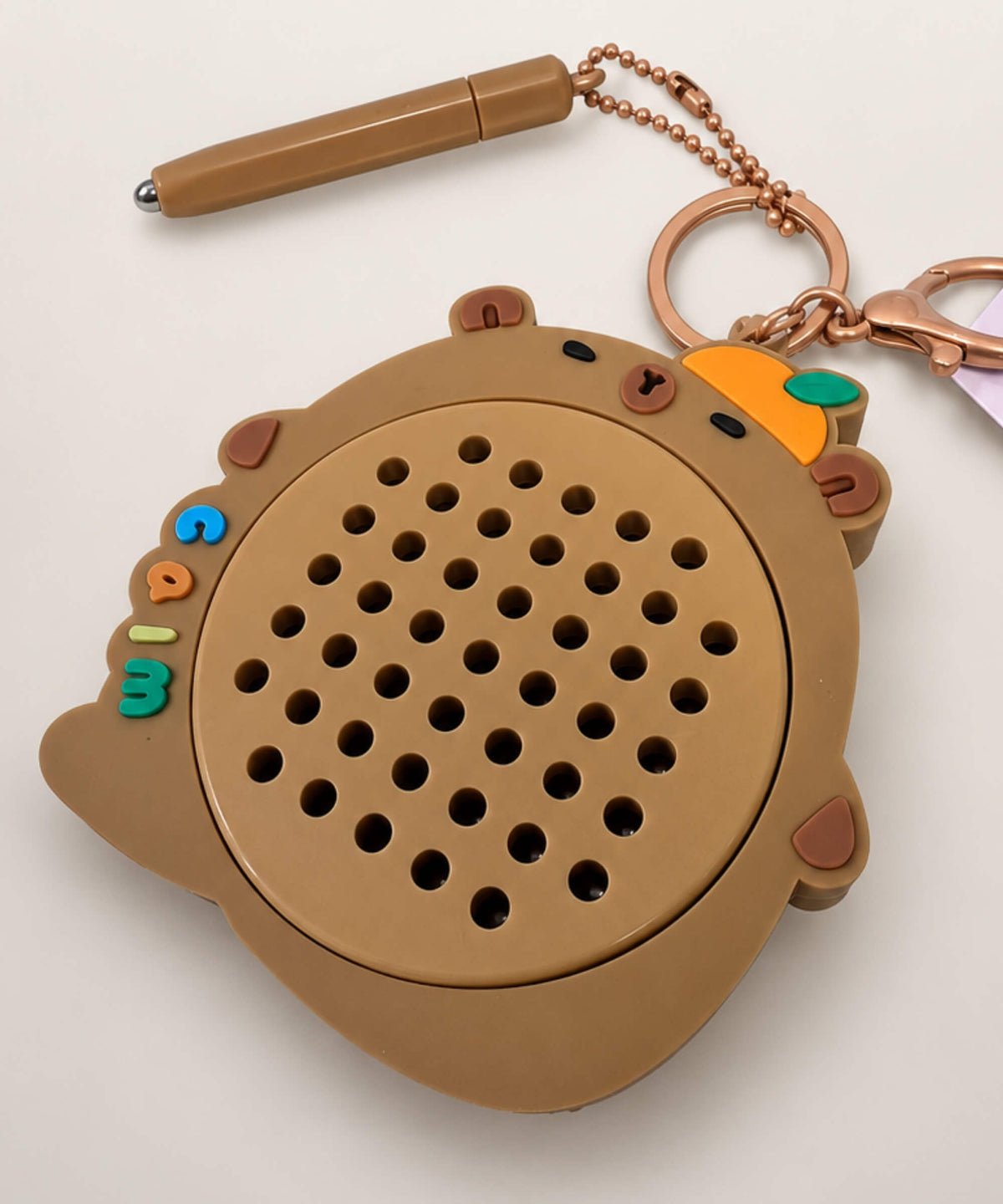 Close-up of Brown Orange capybara magnetic bead drawing keychain board