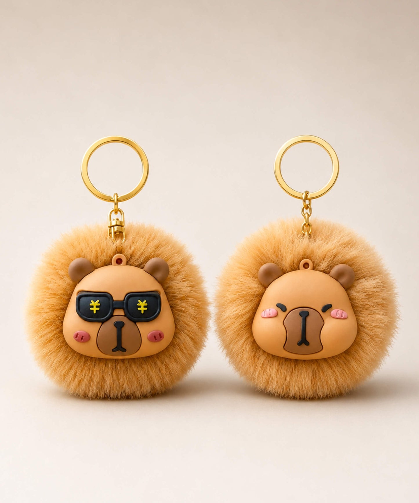 Two capybara plush keychains in different face styles