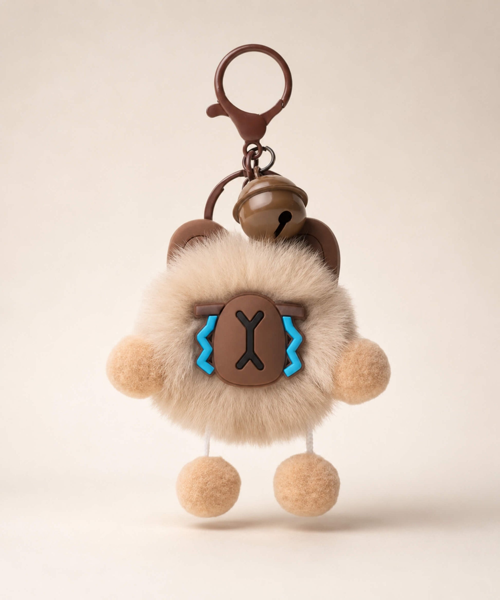 Capybara plush keychain with fluffy body, brown charm details and dangling pom pom feet