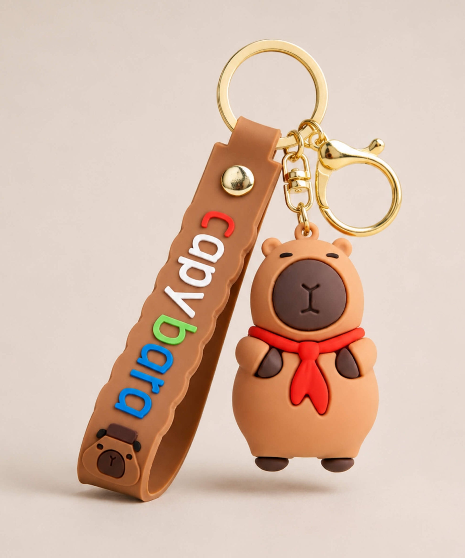 Capybara Red Scarf classic keychain with brown strap and gold hardwa