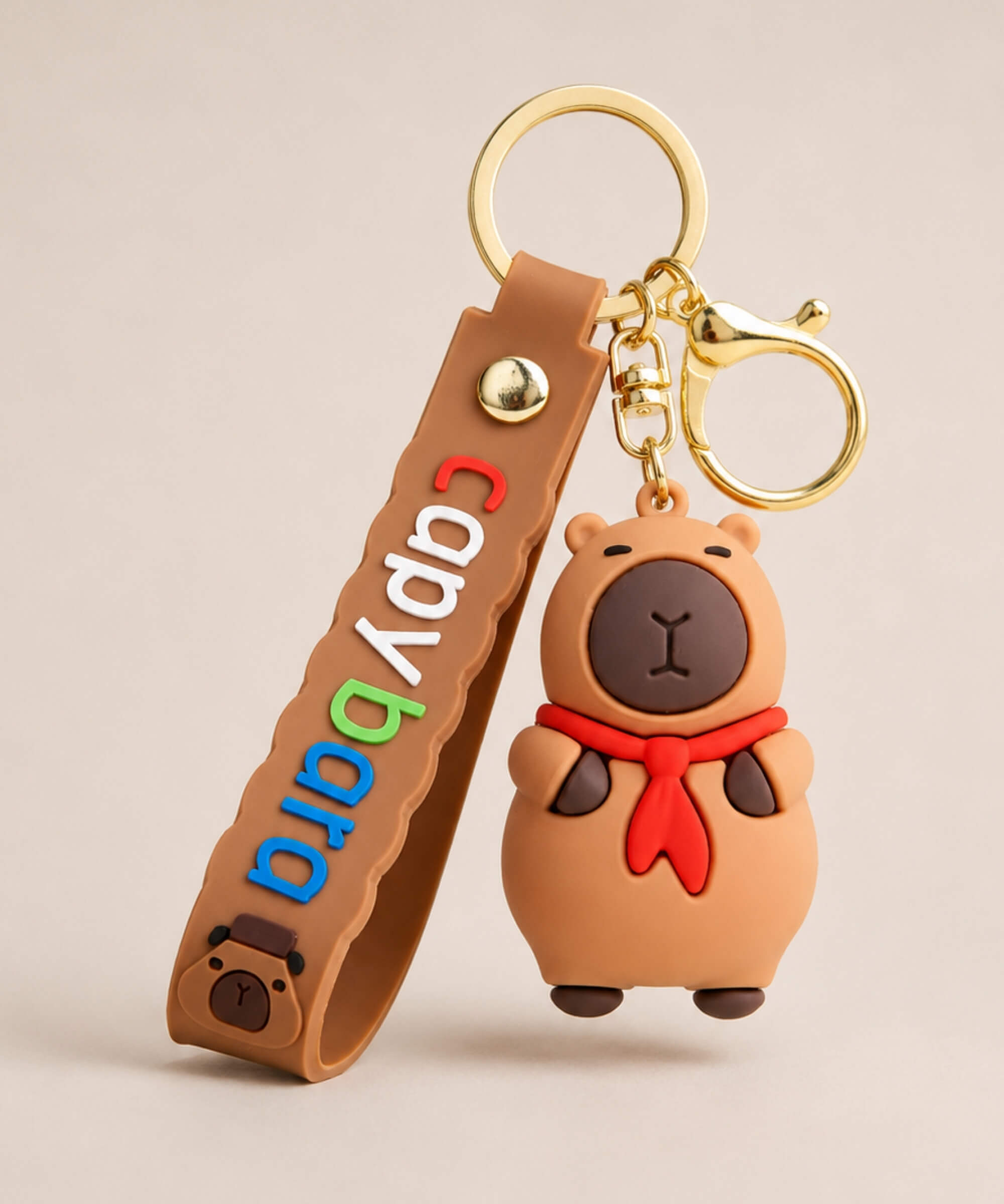 Capybara Red Scarf classic keychain with brown strap and gold hardwa