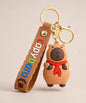 Capybara Red Scarf classic keychain with brown strap and gold hardwa