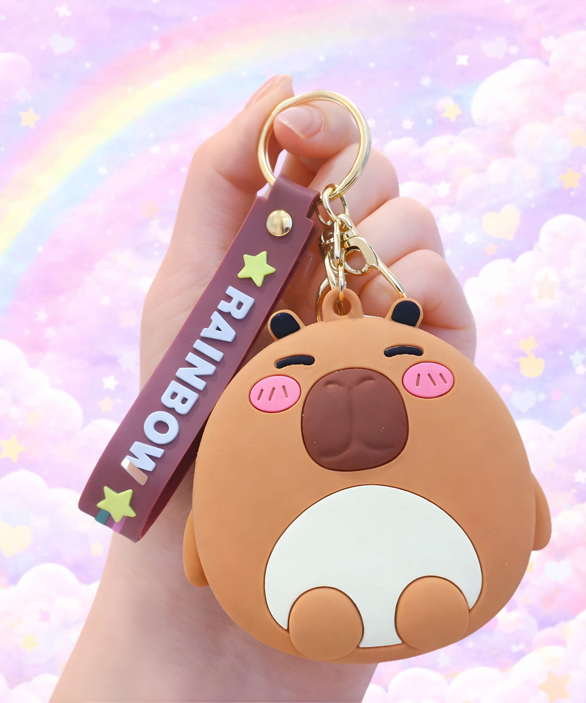 Capybara silicone coin purse keychain held in hand, cute mini wallet pouch bag charm with pastel background