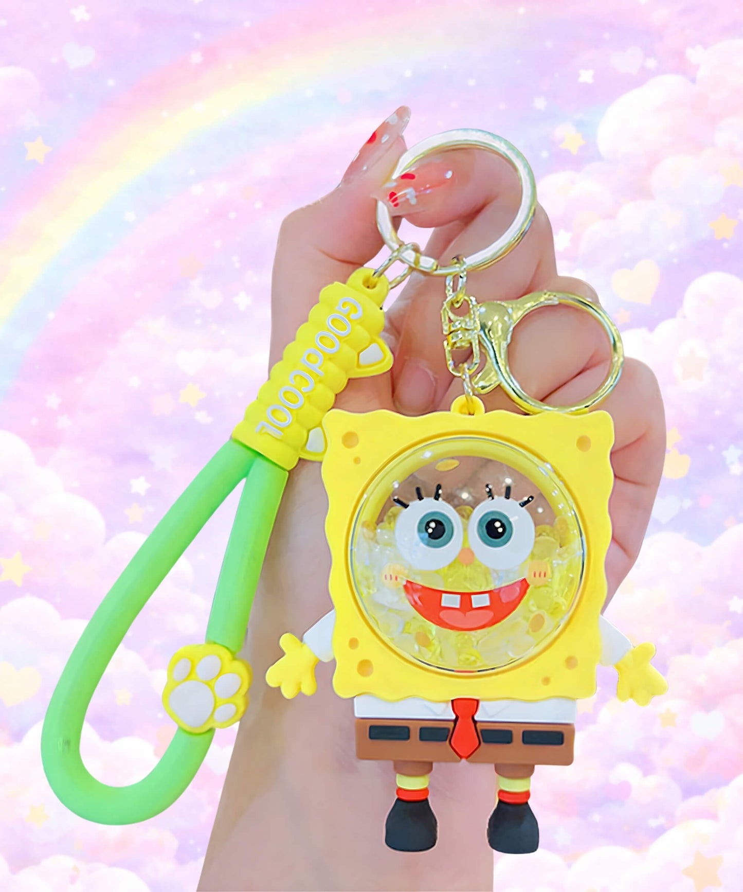 Cartoon sponge style bubble bead shaker keychain held in hand, cute yellow character bag charm with pastel rainbow background