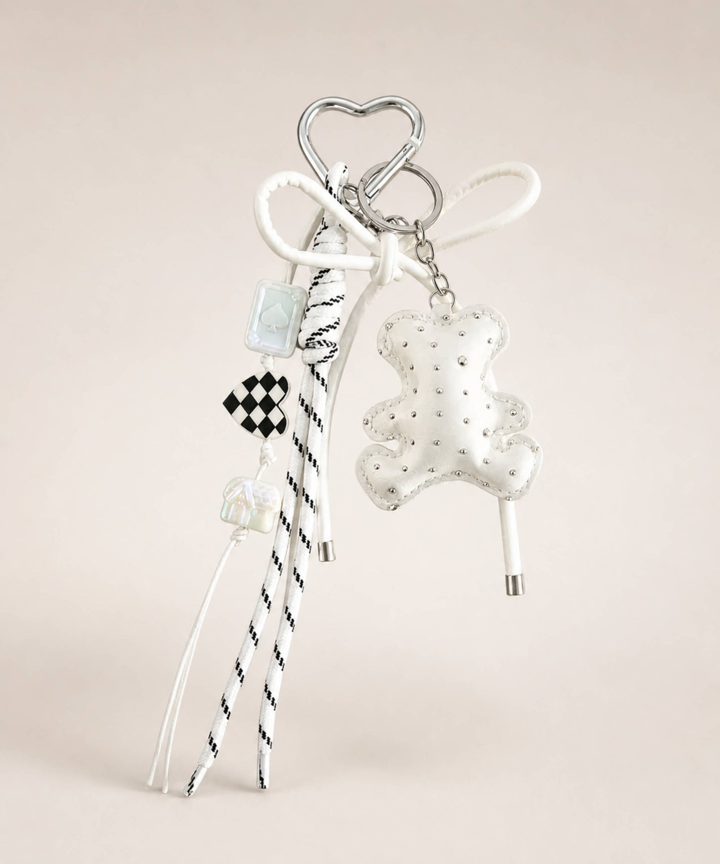 White bear PU leather bag charm keychain with a sparkle charm and decorative hanging charms on a neutral background.