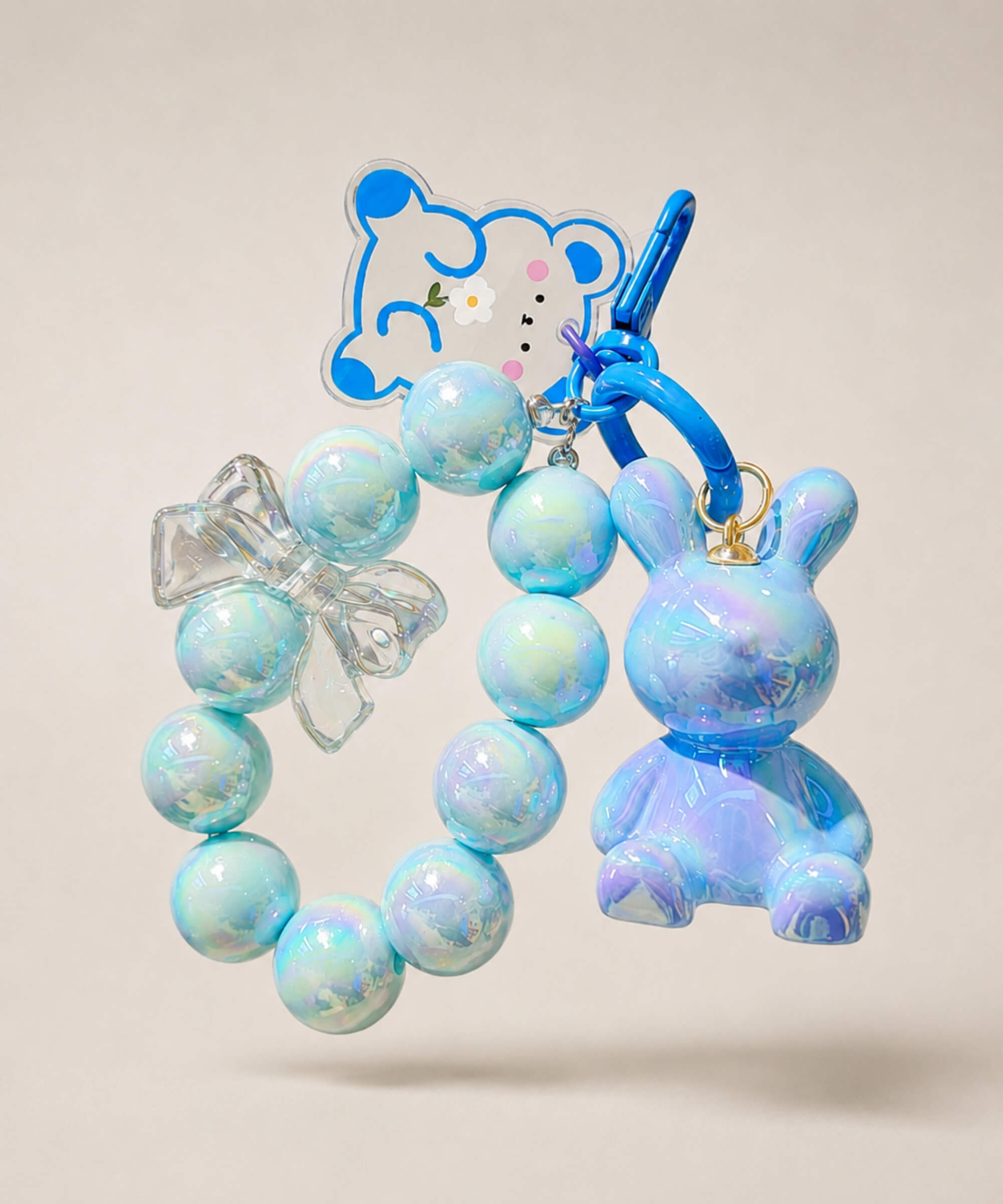 Blue bunny beaded keychain with rabbit charm and bow detail on a neutral background