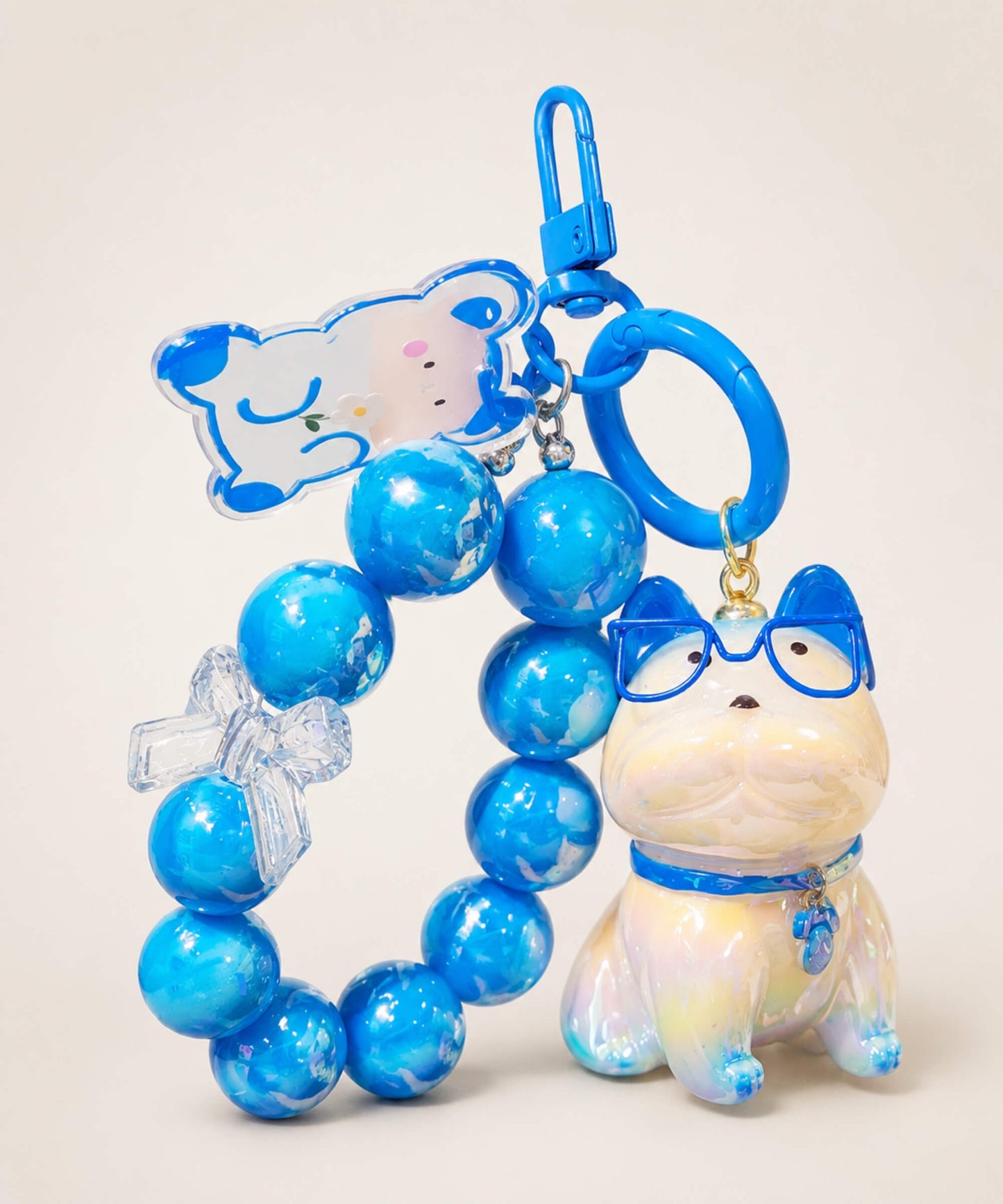 Blue French Bulldog beaded keychain with glasses, bead loop and charm details on a neutral background