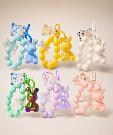 Bunny beaded keychains in assorted colour options displayed together on a neutral background