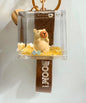 Capybara style liquid shaker keychain with hugging character inside acrylic cube