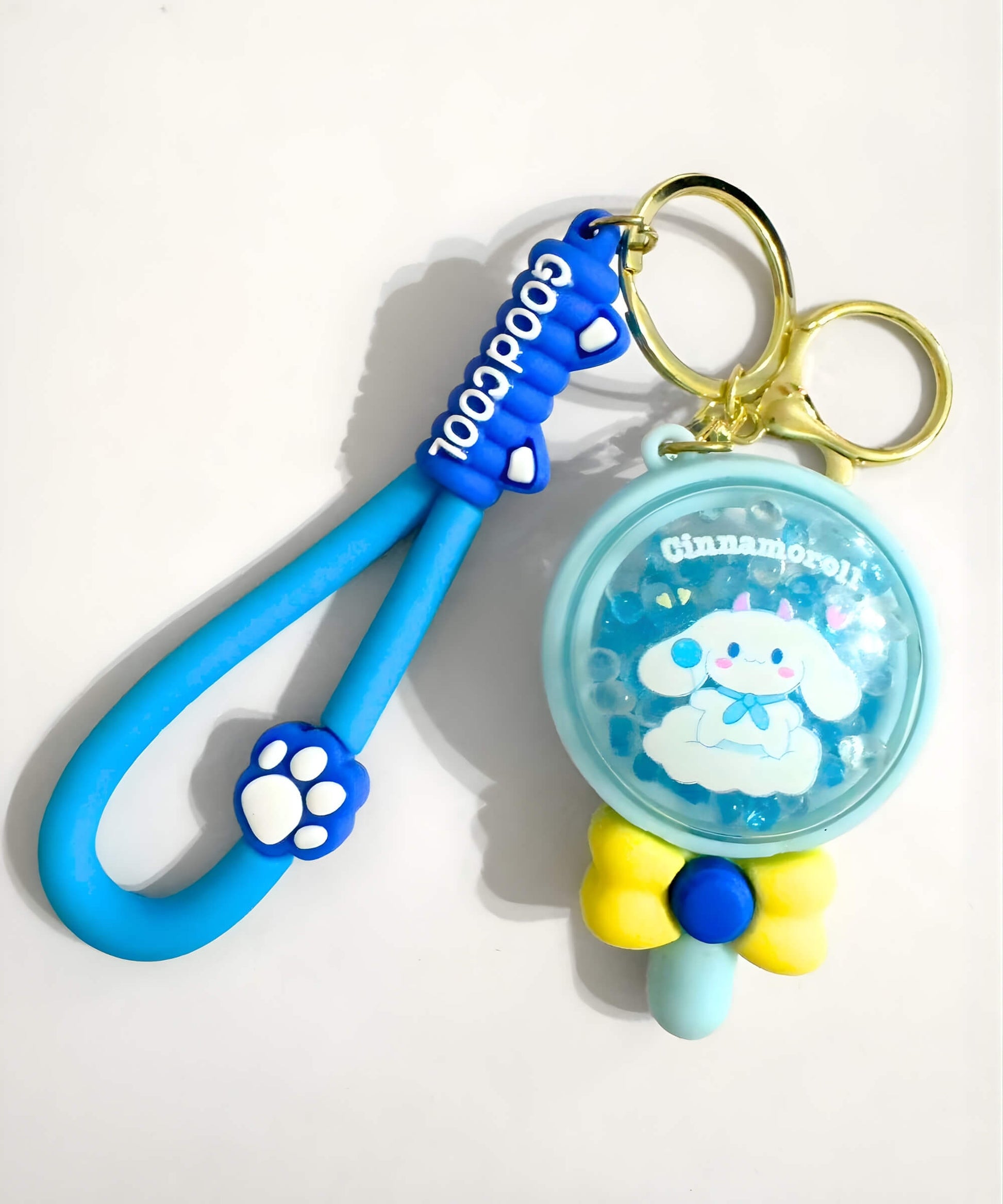 Cinnamoroll bead shaker keychain with blue lollipop design and floating beads