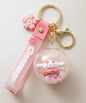 Cinnamoroll donut shaker keychain with floating beads inside clear charm