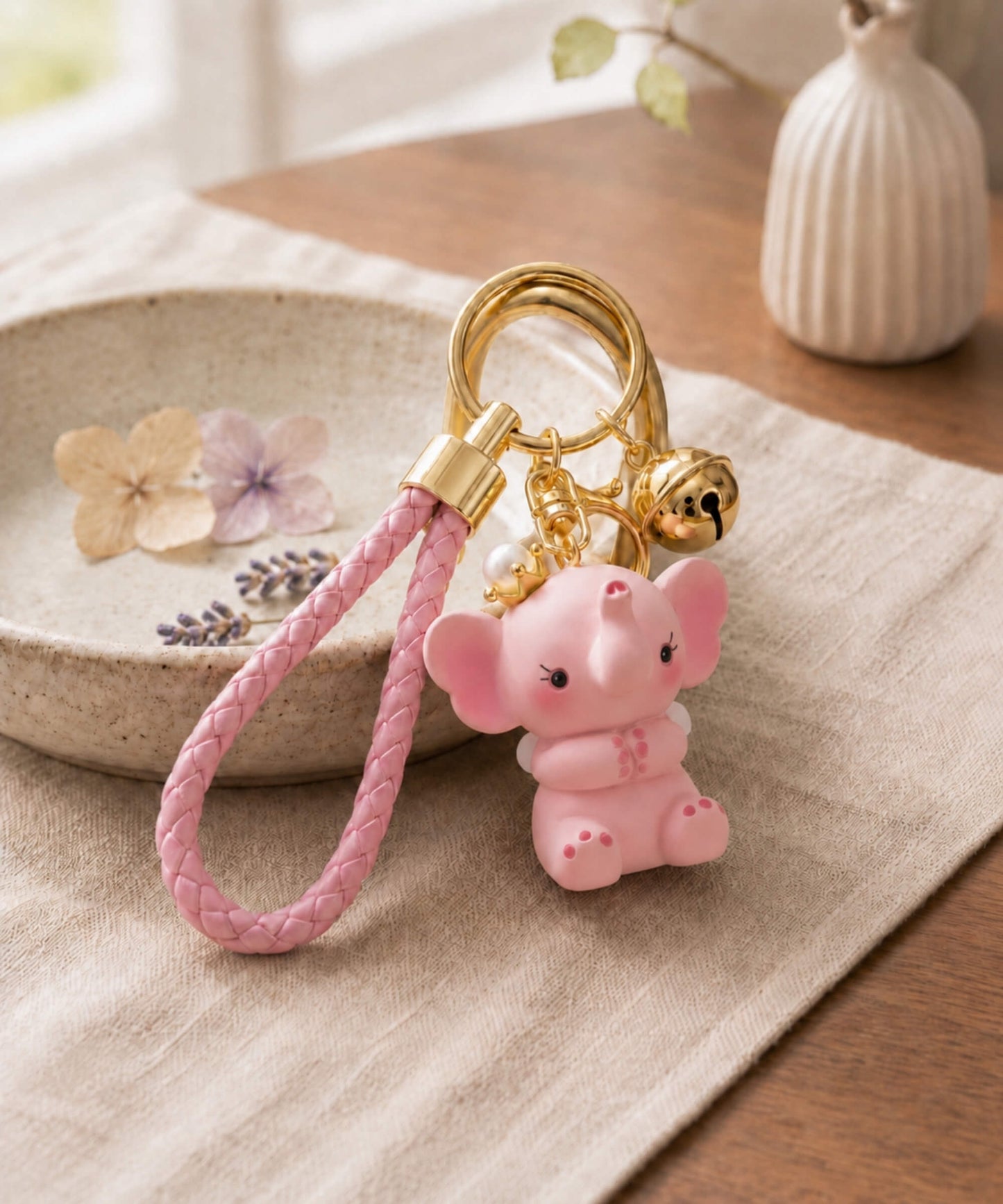 Pink elephant resin keychain flatlay