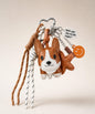 Brown Cute Corgi PU leather bag charm keychain with tassel cords and decorative charms on a neutral studio background.