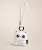 Cute Kitty PU leather keychain in white with purple eyes and wrist strap on a neutral studio background.