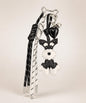 Black Cute Schnauzer faux leather bag charm with heart pendant and tassel cords on a minimal neutral background.