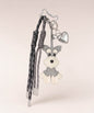 Grey Cute Schnauzer PU leather bag charm with silver heart pendant and tassel cords on a neutral studio background.