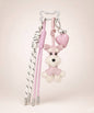 Pink Cute Schnauzer PU leather bag charm with heart pendant and tassel cords on a neutral studio background.