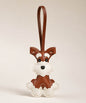 Brown Cute Schnauzer PU leather keychain with matching wrist strap on a soft neutral studio background.