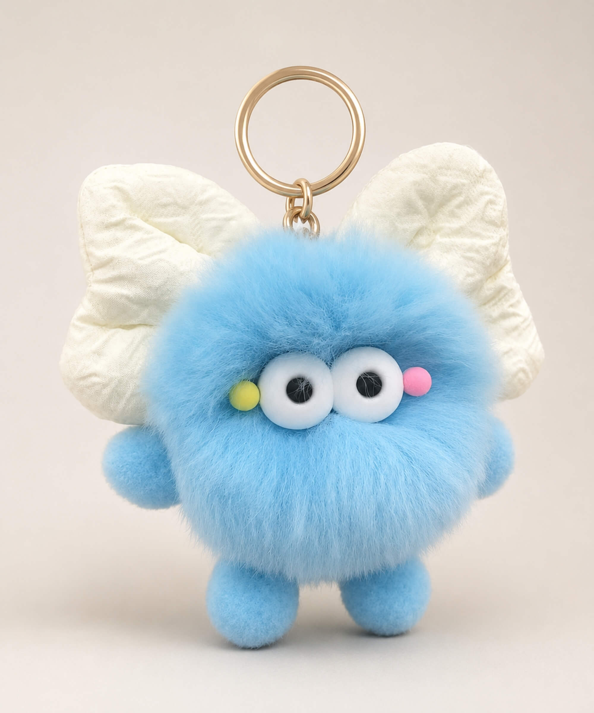 Blue fluffy bow plush keychain with cream bow-style ears and cute bag charm design
