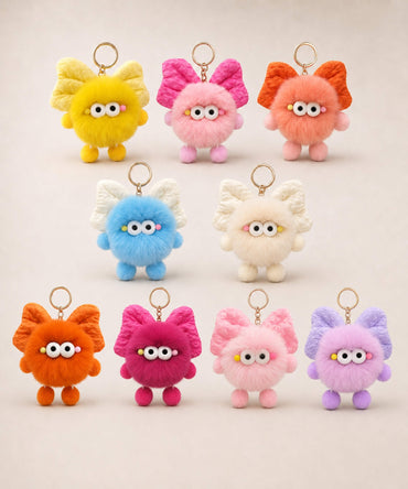 Fluffy bow plush keychains in assorted colours with cute wide-eye details and gold-tone key ring hardware