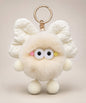 Cream fluffy bow plush keychain with soft furry body and cute wide-eye details