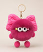 Rose pink fluffy bow plush keychain with soft furry texture, cute wide-eye design and gold-tone hardware