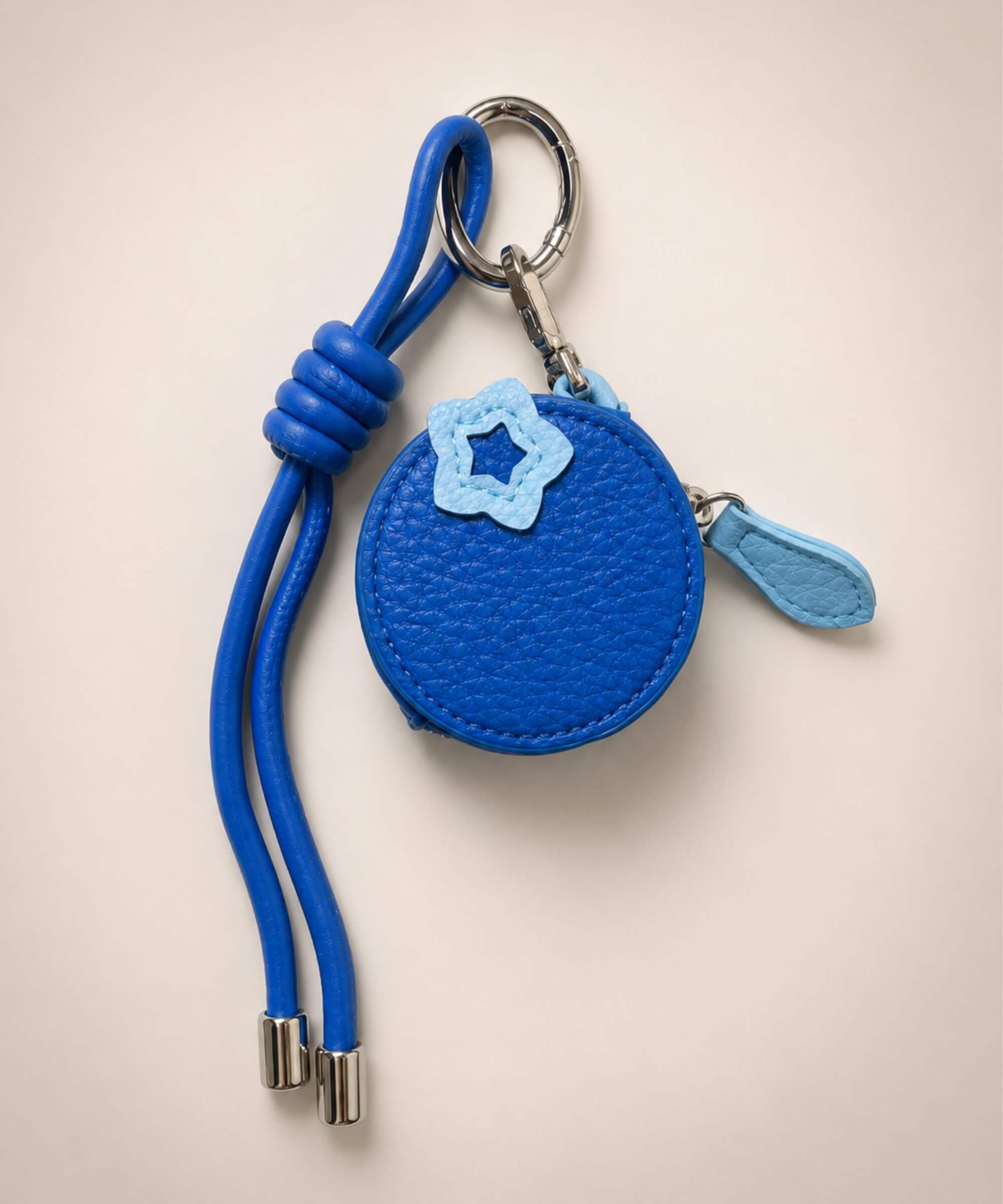 Blueberry fruit coin purse keychain with blue PU leather-style pouch, flower detail and matching strap