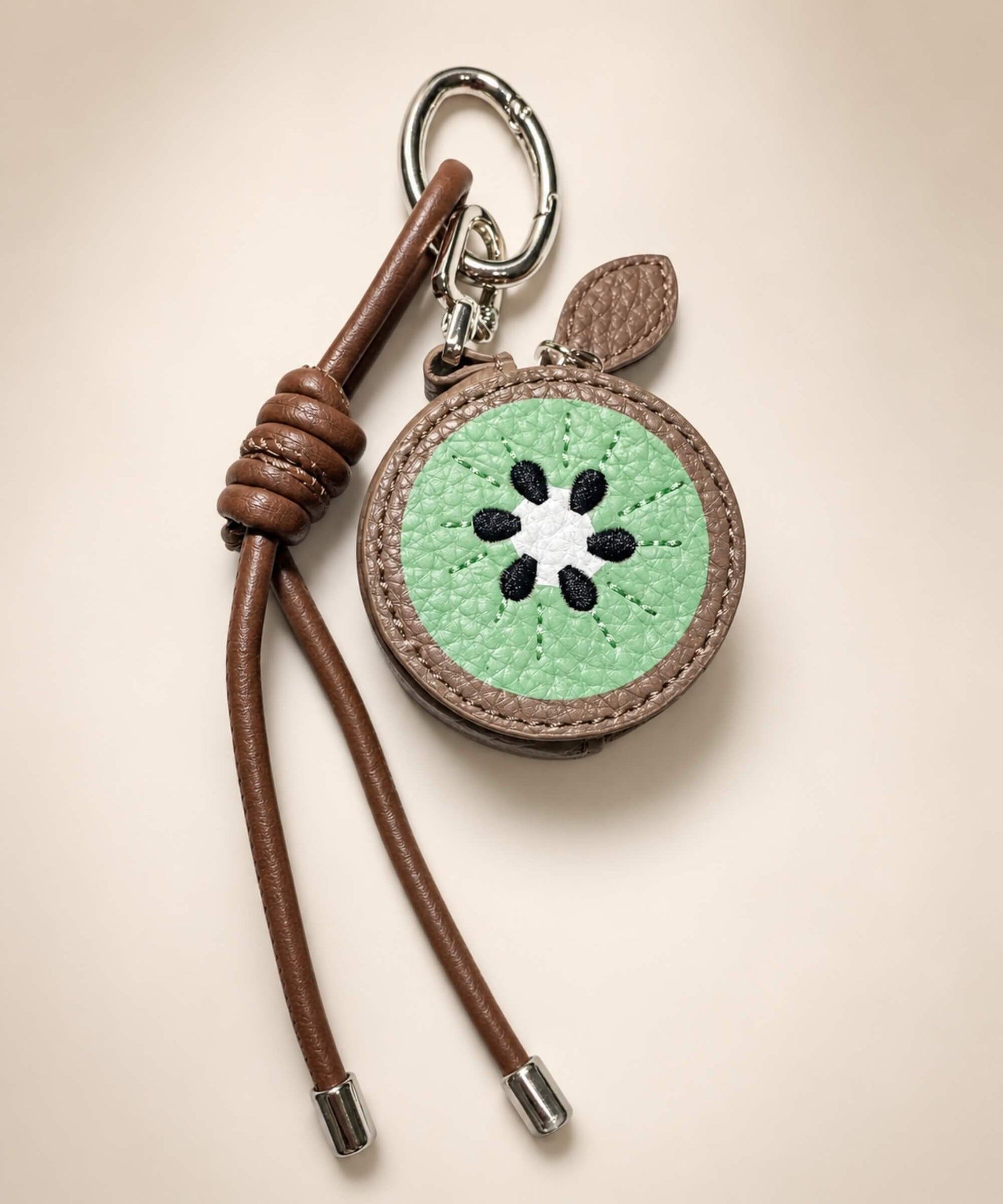 Kiwi fruit coin purse keychain with brown PU leather-style pouch, green kiwi detail and matching strap