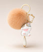 Grey cat pom pom resin keychain with peach fluffy plush ball and gold hardware on a neutral background