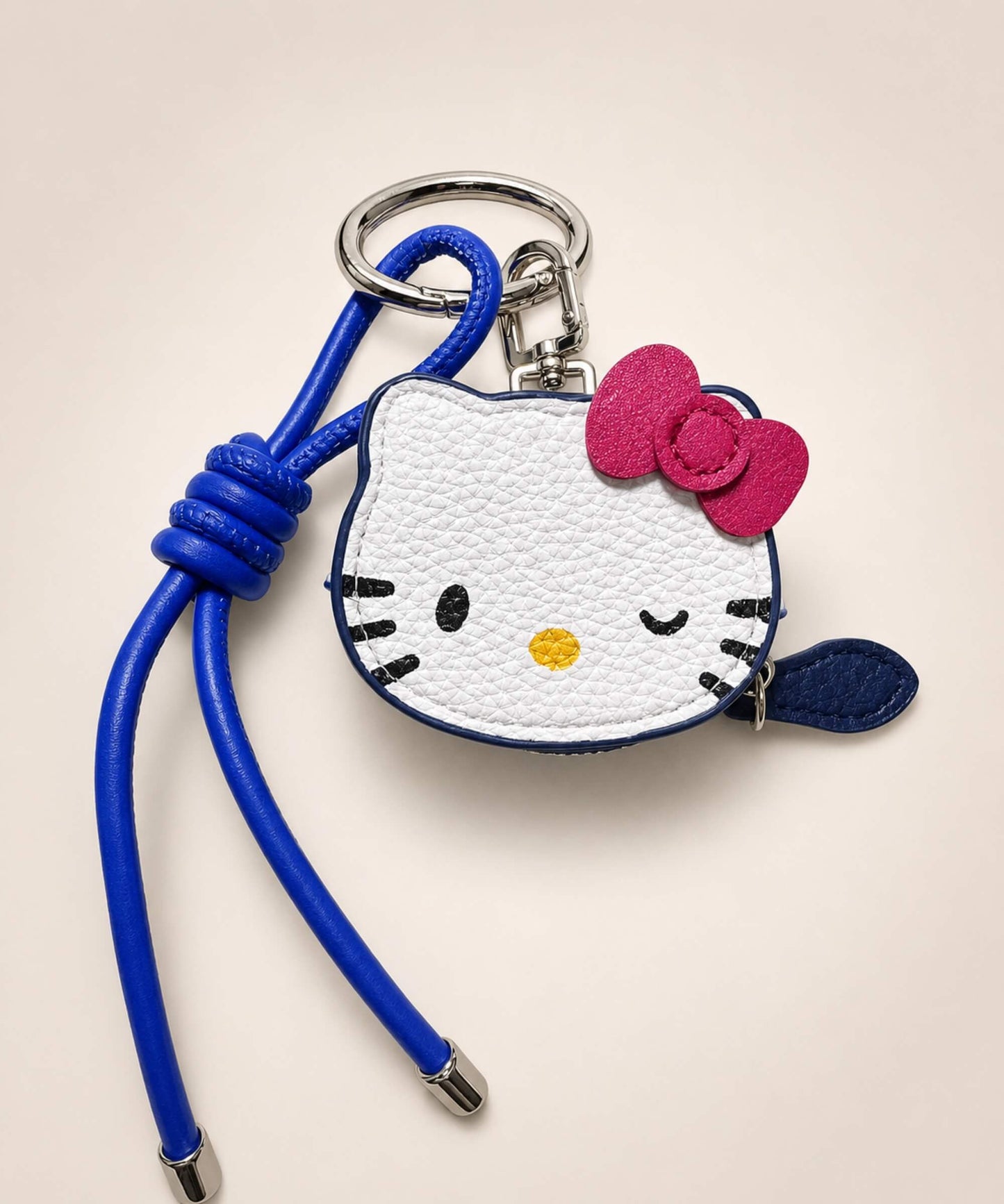 Hello Kitty coin purse keychain with blue strap, bow detail and PU leather-style mini pouch