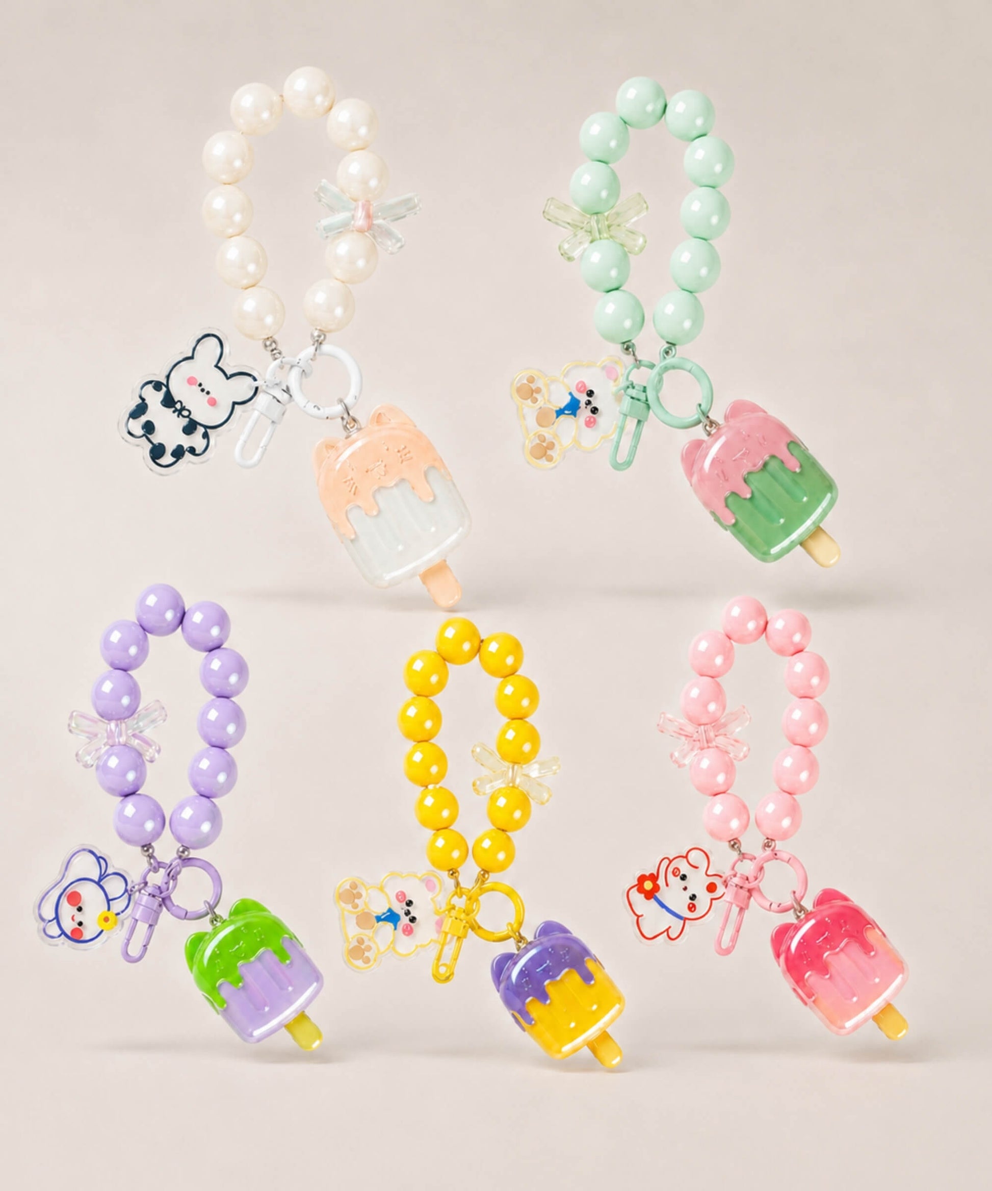 Ice cream beaded keychains in assorted colour options displayed together on a neutral background
