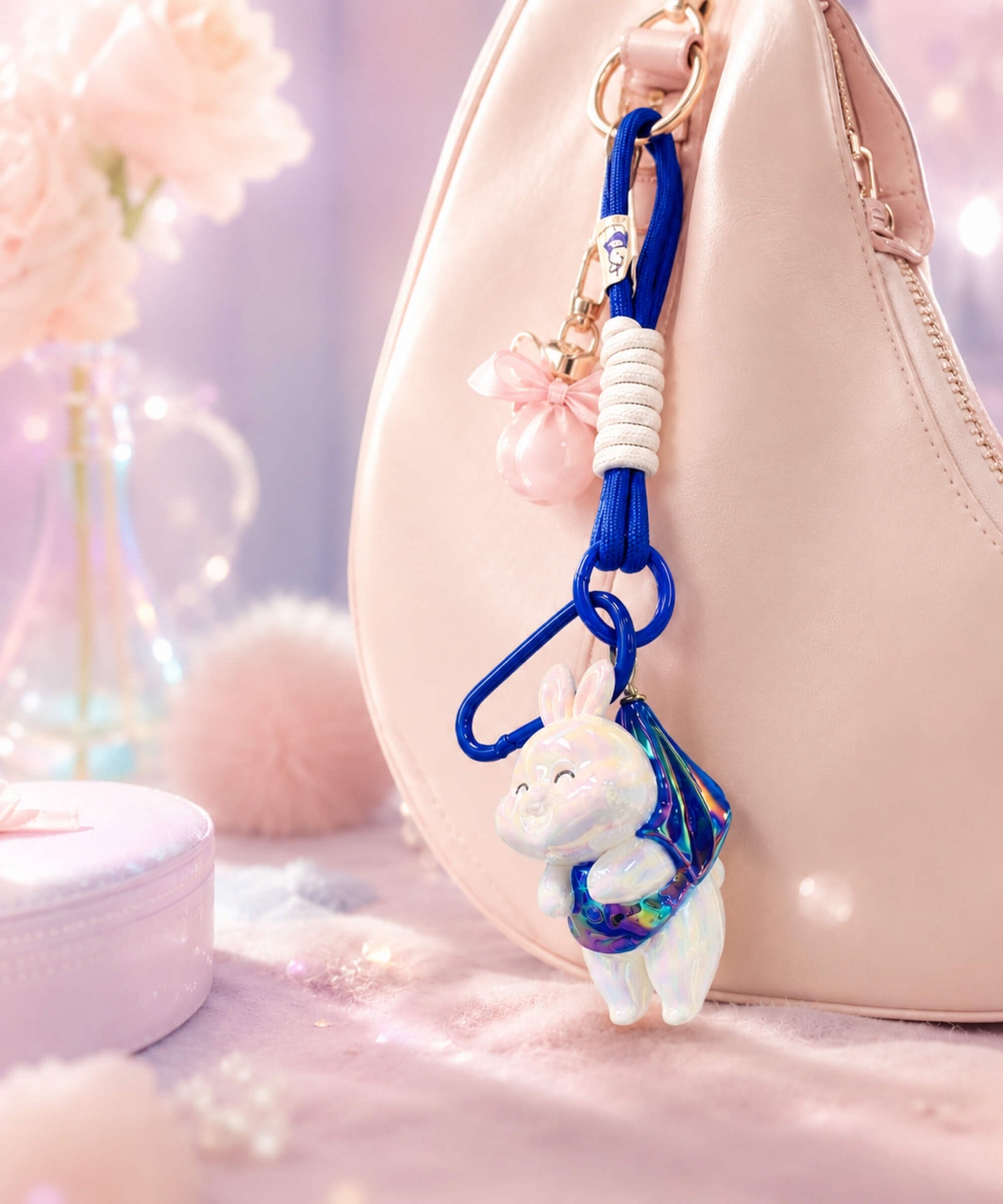 Blue bunny resin keychain on pink bag